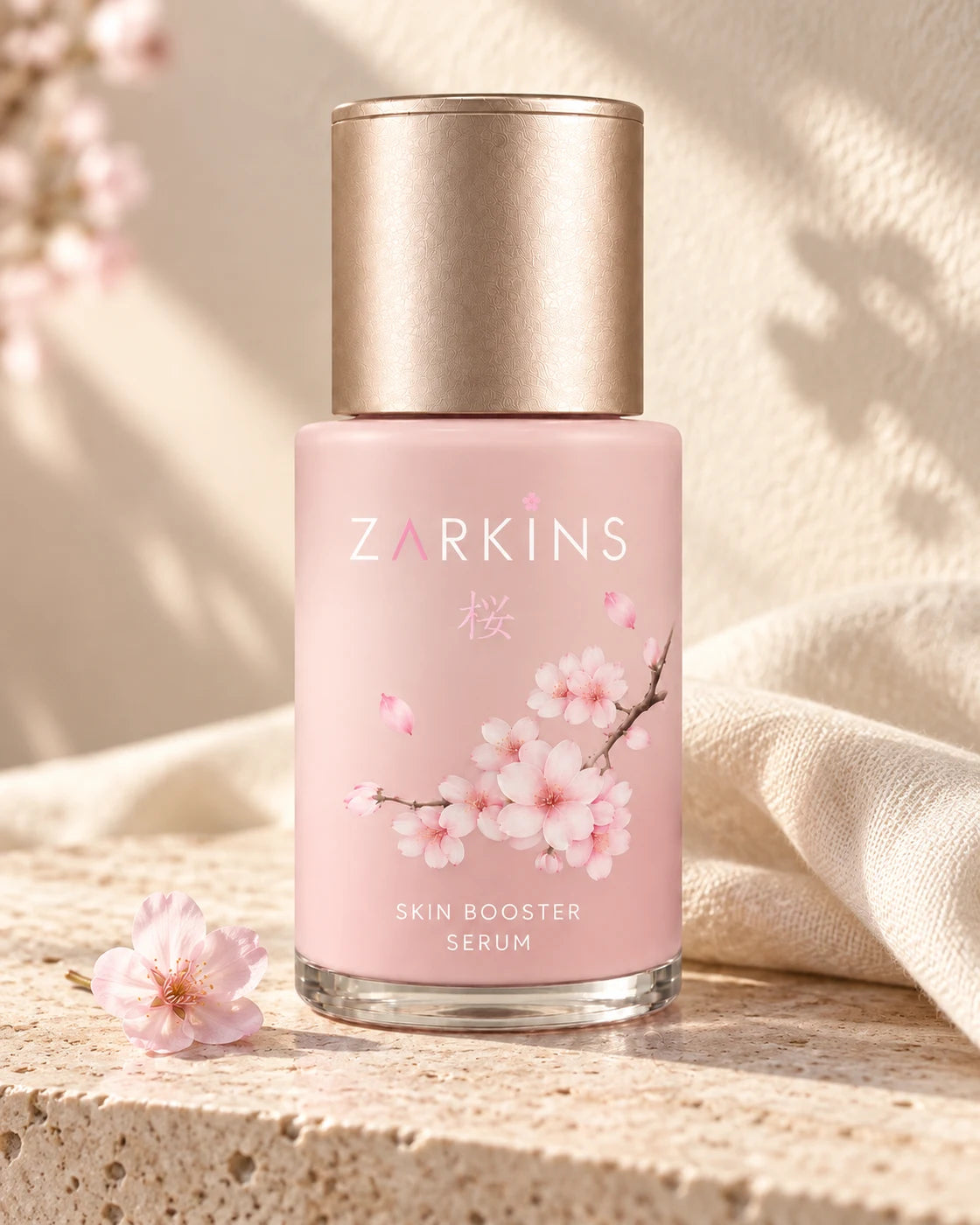Sakura bottle beside soft linen on pale stone